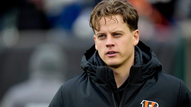 Joe Burrow stands on the sidelines prior to a game.